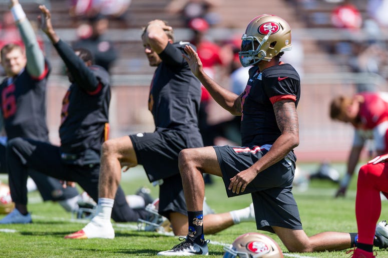 Aug 10, 2016; San Francisco, CA, USA; San Francisco 49ers quarterback Colin Kaepernick (7) and quarterback Blaine Gabbert (2) warm up during the training camp at Kezar Stadium. Mandatory Credit: John Hefti-USA TODAY Sports