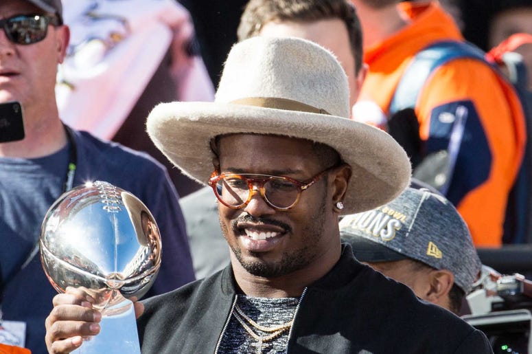 Feb 9, 2016; Denver, CO, USA; Denver Broncos outside linebacker Von Miller (58) holds the Vince Lombardi Trophy during the Super Bowl 50 championship parade celebration at Civic Center Park. Mandatory Credit: Isaiah J. Downing-USA TODAY Sports