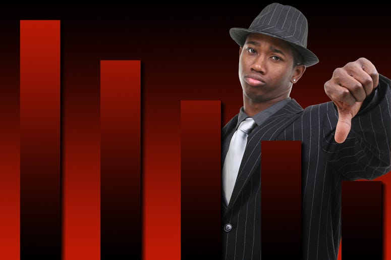 Businessman With Thumb Down Over Falling Graph Background. Red and black graph.