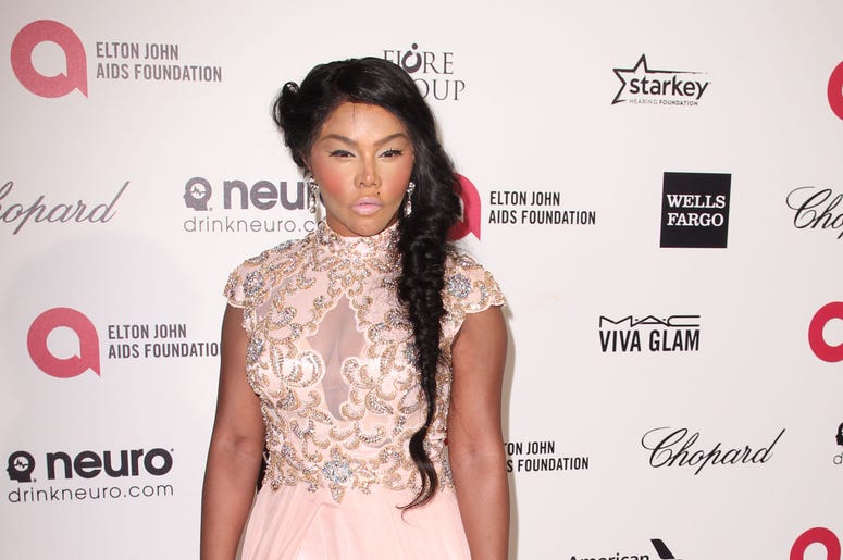 Lil Kim arrives at the 23rd Annual Elton John AIDS Foundation Oscar Viewing Party held in West Hollywood, CA on February 22, 2015. (Photo By John Salangsang) *** Please Use Credit from Credit Field ***