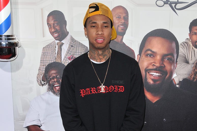 Tyga arrives at the "Barbershop: The Next Cut" Los Angeles Premiere held at the TCL Chinese Theatre in Hollywood, CA on Wednesday, April 6, 2016 (Photo By Sthanlee B. Mirador) *** Please Use Credit from Credit Field **