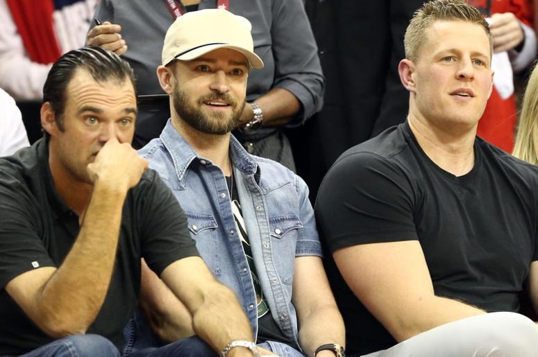 May 24, 2018; Houston, TX, USA; Singer Justin Timberlake and Houston Texans defensive end J.J. Watt and girlfriend Kealia Ohai sit on the sideline during game five of the Western conference finals of the 2018 NBA Playoffs between the Houston Rockets and t