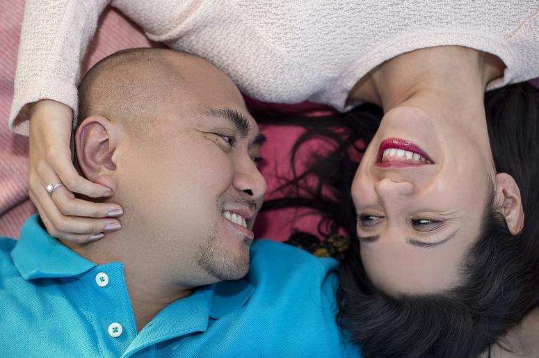 Latino Couple Laying Down. American, marriage.
