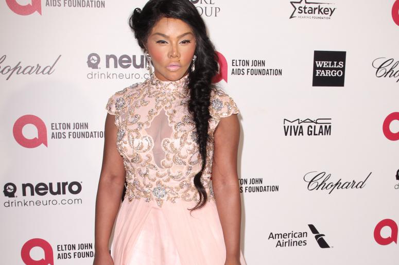 Lil Kim arrives at the 23rd Annual Elton John AIDS Foundation Oscar Viewing Party held in West Hollywood, CA on February 22, 2015. (Photo By John Salangsang) *** Please Use Credit from Credit Field ***