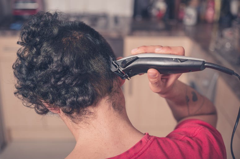Guy cuts his own hair Guy cuts his own hair