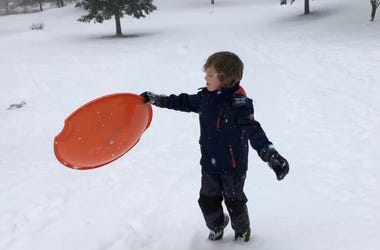 Dawson with a snow saucer Dawson with a snow saucer
