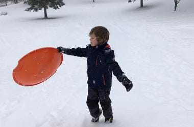 Dawson with a snow saucer Dawson with a snow saucer