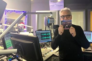 John Fisher holding The Cory Band CD John Fisher holding The Cory Band CD