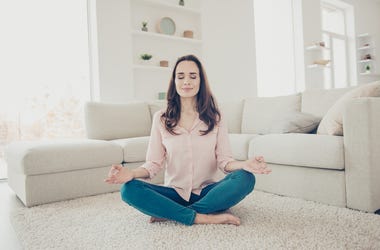 Woman meditating at home Woman meditating at home