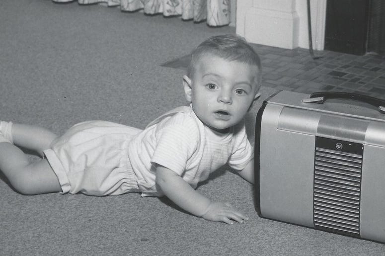 Young John and an old radio Young John and an old radio