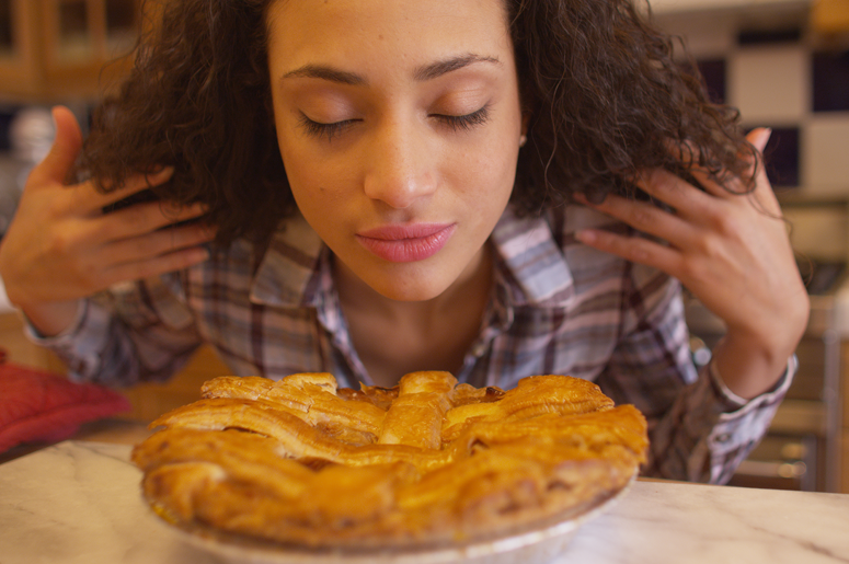 Woman smelling apple pie