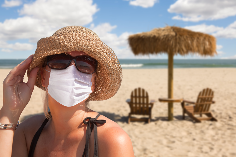 Woman wearing mask on beach