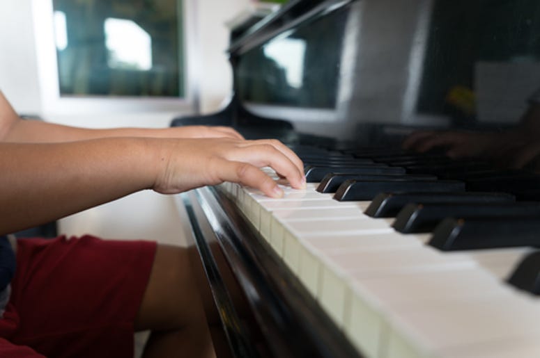 Kid playing the piano