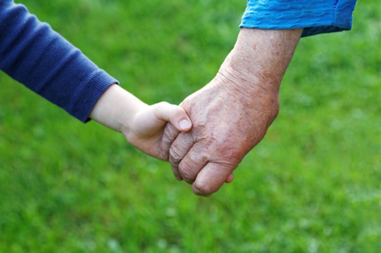 8 year old boy helps eldery lady 8 year old boy helps eldery lady