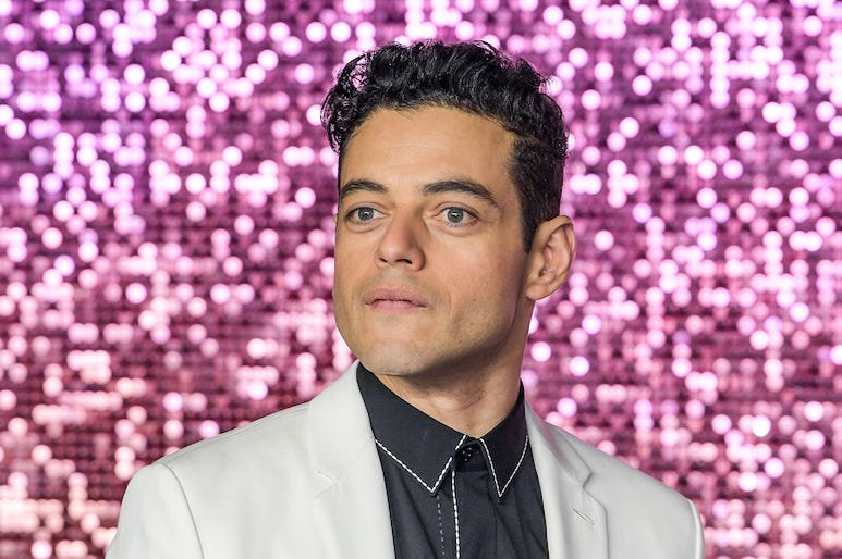 Rami Malek, White Suit, Bohemian Rhapsody, World Premiere, Pink Background Rami Malek, White Suit, Bohemian Rhapsody, World Premiere, Pink Background