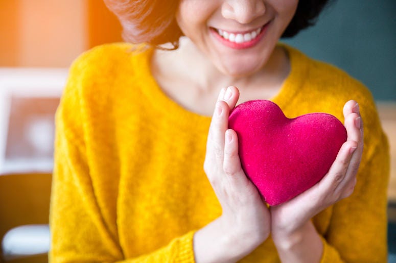 Woman Holding a heart