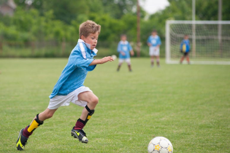 Kid Playing Soccer