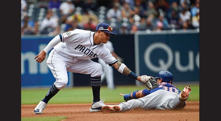 Michael Conforto #30 of the New York Mets steals second base ahead of the tag of Manny Machado #13 of the San Diego Padres during the seventh inning of a baseball game at Petco Park May 8, 2019 in San Diego, California. (Photo by Denis Poroy/Getty Images)