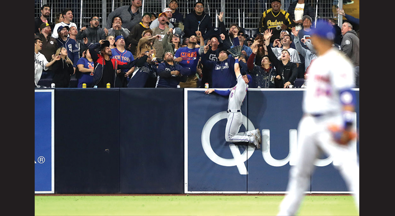 Jeff McNeil #6 of the New York Mets is unable to reach a solo homerun hit by Hunter Renfroe #10 of the San Diego Padres during the fifth inning of a game against the New York Mets at PETCO Park on May 06, 2019 in San Diego, California. (Photo by Sean M. H