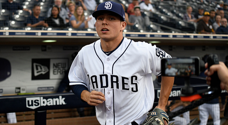 AUGUST 28: Luis Urias #9 of the San Diego Padres comes onto the field before a baseball game against the Seattle Mariners at PETCO Park on August 28, 2018 in San Diego, California. (Photo by Denis Poroy/Getty Images)