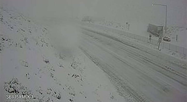 A snow-covered I-15 through the Cajon Pass on 12-26-19