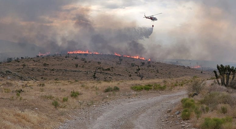 Crews work to put out the Cottonwood Fire burning near Goodsprings on 7-20-20