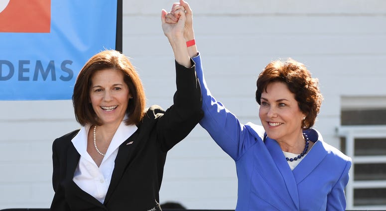 U.S. Sen. Catherine Cortez Masto (D-NV) (L) introduces U.S. Rep. and U.S. Senate candidate Jacky Rosen (D-NV) during a rally at the Culinary Workers Union Hall Local 226 featuring former U.S. Vice President Joe Biden on October 20, 2018