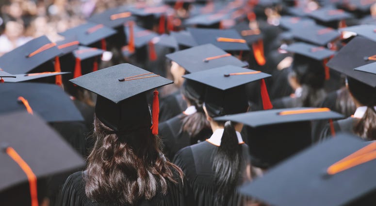 backside graduation hats during commencement success graduates of the university