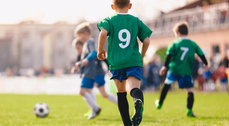 A group of boys playing soccer