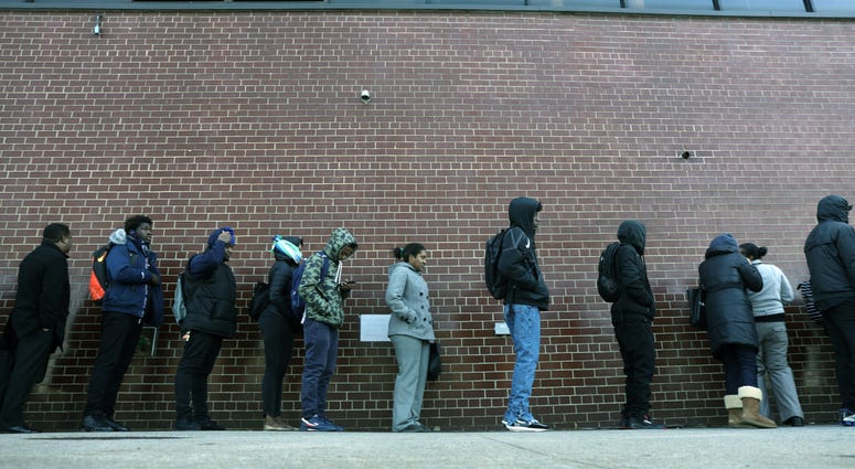 People wait in line for a job fair at a United Parcel Service (UPS) facility on November 01, 2019 in New York City.
