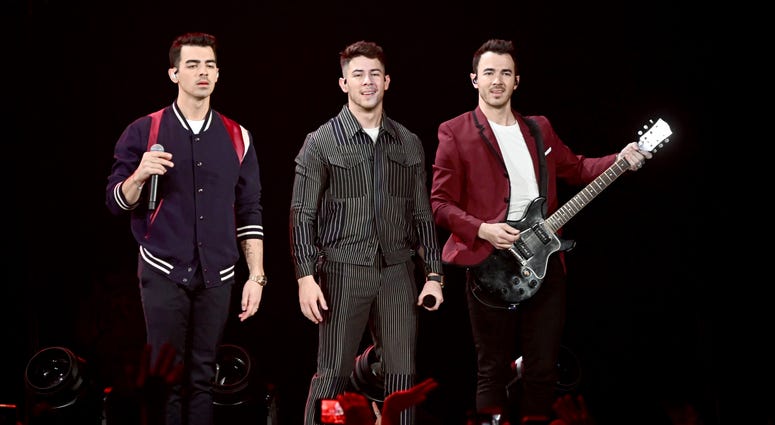 Nick Jonas, Joe Jonas, Kevin Jonas of the Jonas Brothers perform during 103.5 KISS FM's Jingle Ball 2019 - Show on December 18, 2019 in Chicago, Illinois.