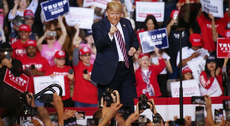 US President Donald Trump points to the crowd at a campaign rally at Las Vegas Convention Center on February 21, 2020 in Las Vegas, Nevada.