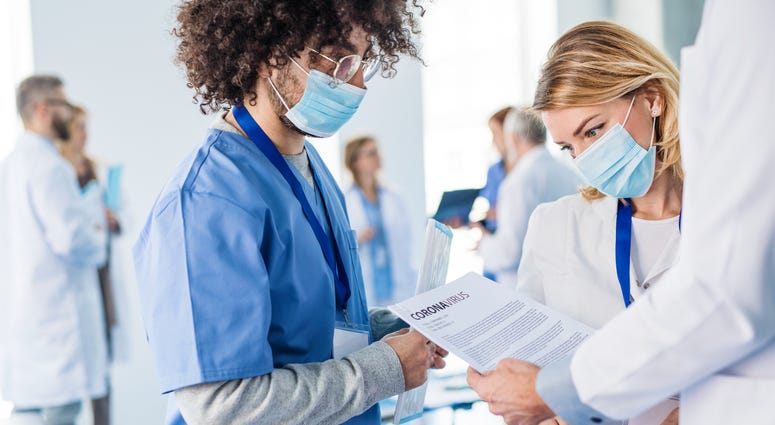 Doctors in hospital discussing coronavirus
