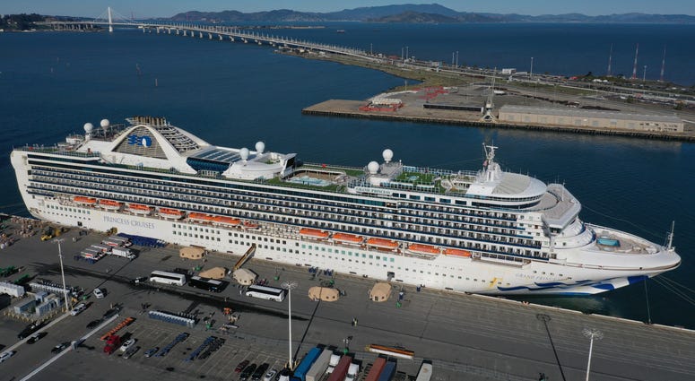 Passengers disembark from the Princess Cruises Grand Princess cruise as it sits docked in the Port of Oakland on March 10, 2020 in Oakland, California.