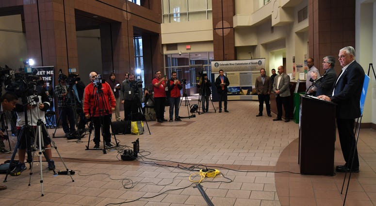 Nevada Gov. Steve Sisolak (R) speaks to members of the media, who were asked to spread out every six feet to maintain social distancing, during a news conference on the state's response to the coronavirus outbreak at the Grant Sawyer State Office Building