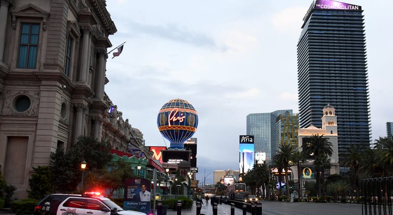 A Las Vegas Metropolitan Police Department vehicle is parked at Paris Las Vegas as parts of the Las Vegas Strip go dark as a result of the statewide shutdown due to the continued spread of coronavirus across the United States on March 19, 2020