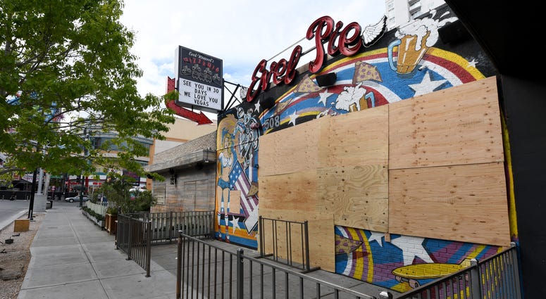 The closed Evel Pie restaurant in the Fremont East Entertainment District is boarded up as a result of the statewide shutdown due to the continuing spread of the coronavirus across the United States on March 22, 2020