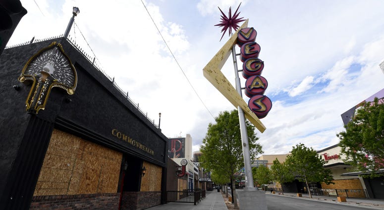 The closed Commonwealth bar in the Fremont East Entertainment District is boarded up as a result of the statewide shutdown due to the continuing spread of the coronavirus across the United States on March 22, 2020