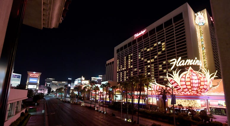 An exterior view shows a nearly empty Las Vegas Strip below guest rooms at the shuttered Flamingo Las Vegas