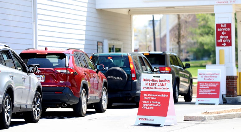 Cars line up for a drive-thru coronavirus (COVID-19) test at CVS Pharmacy on May 15, 2020 in Carver, Massachusetts.