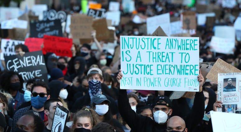 Demonstrators protest in response to the recent death of George Floyd on May 31, 2020 in Boston, Massachusetts.