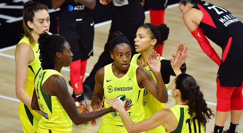 Breanna Stewart #30, Natasha Howard #6, Jewell Loyd #24, Alysha Clark #32, and Sue Bird #10 of the Seattle Storm meet after a foul during the first half of Game Two of the WNBA Finals against the Las Vegas Aces