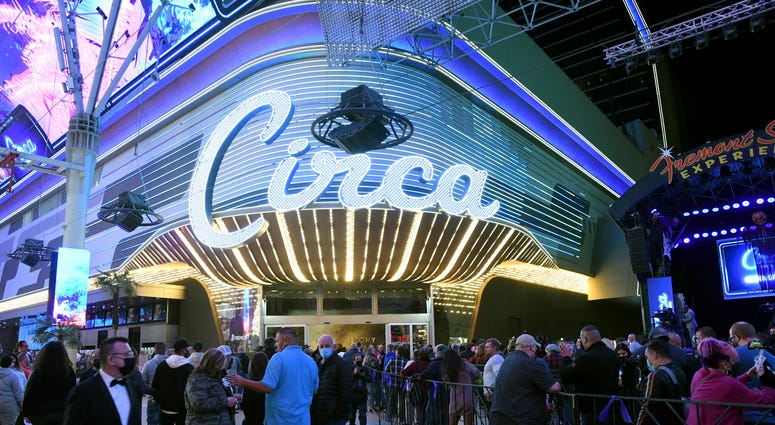 Guests stand in line at the Fremont Street Experience as they wait to enter Circa Resort & Casino during the property's grand opening on October 27, 2020 in Las Vegas, Nevada.
