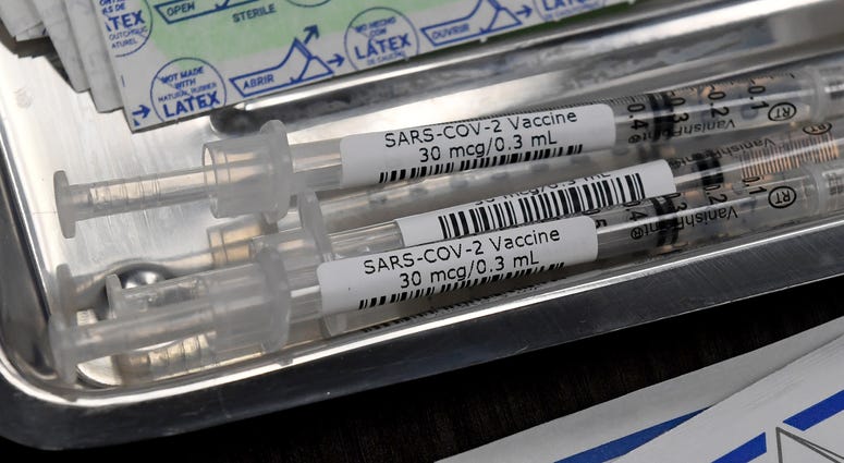 Syringes with the Pfizer-BioNTech COVID-19 vaccine are placed in a tray on a table as vaccinations are given out at University Medical Center of Southern Nevada on December 16, 2020, in Las Vegas, Nevada.