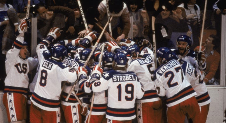 Team USA celebrates their 4-3 victory over the Soviet Union in the semi-final Men's Ice Hockey event at the Winter Olympic Games in Lake Placid, New York on February 22, 1980.