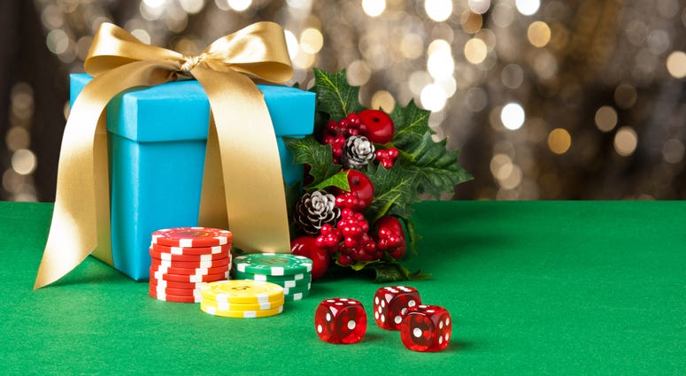 Red dice and poker chips in Christmas setting