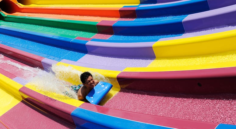 A boy enjoys a waterslide at the opening of Sydney theme park, Wet'n'Wild on December 12, 2013 in Sydney, Australia.