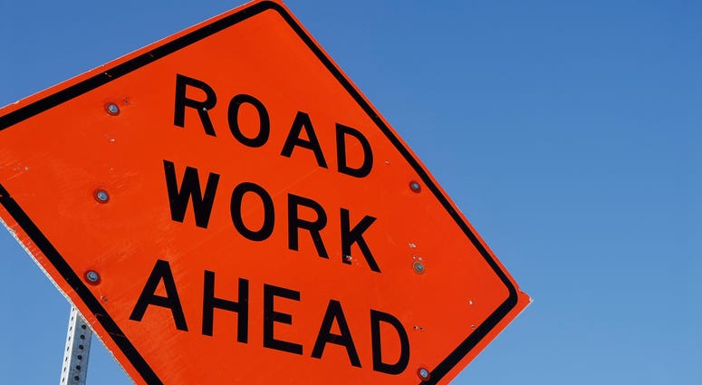 Sign indicating road construction ahead