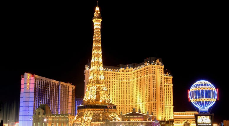 Water from the Bellagio's fountain show is seen in front of the Bally's Las Vegas (L) and Paris Las Vegas, including the Paris' 50-story Eiffel Tower replica, June 30, 2005 in Las Vegas,