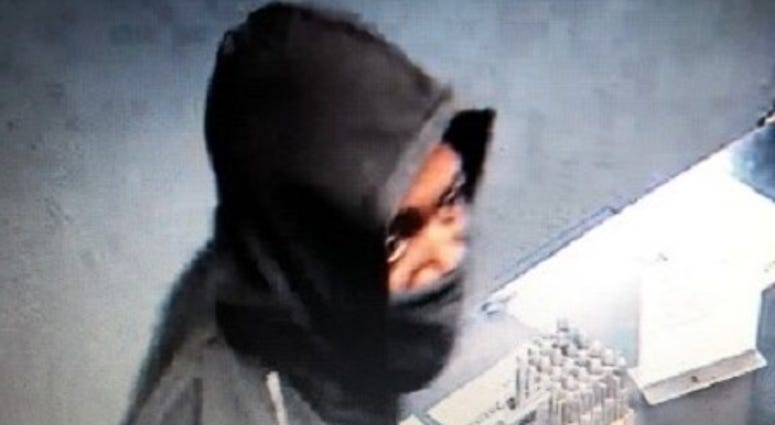 Surveillance snapshot of gun store robbery suspect